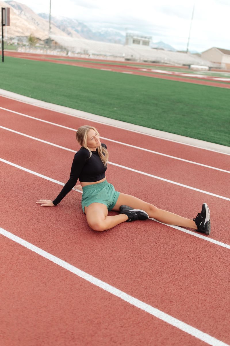 Kiera stretching on the track